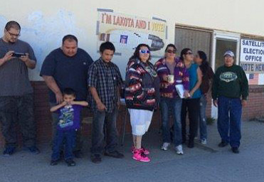 Native voters preparing to cast their ballots at the Shannon County satellite election office.